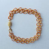 orange and gold chainmaille bracelet with magnetic clasp