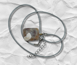 square natural agate Necklace with a pendant on a textured white surface