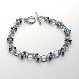 Stainless steel chainmaille bracelet with blue beads